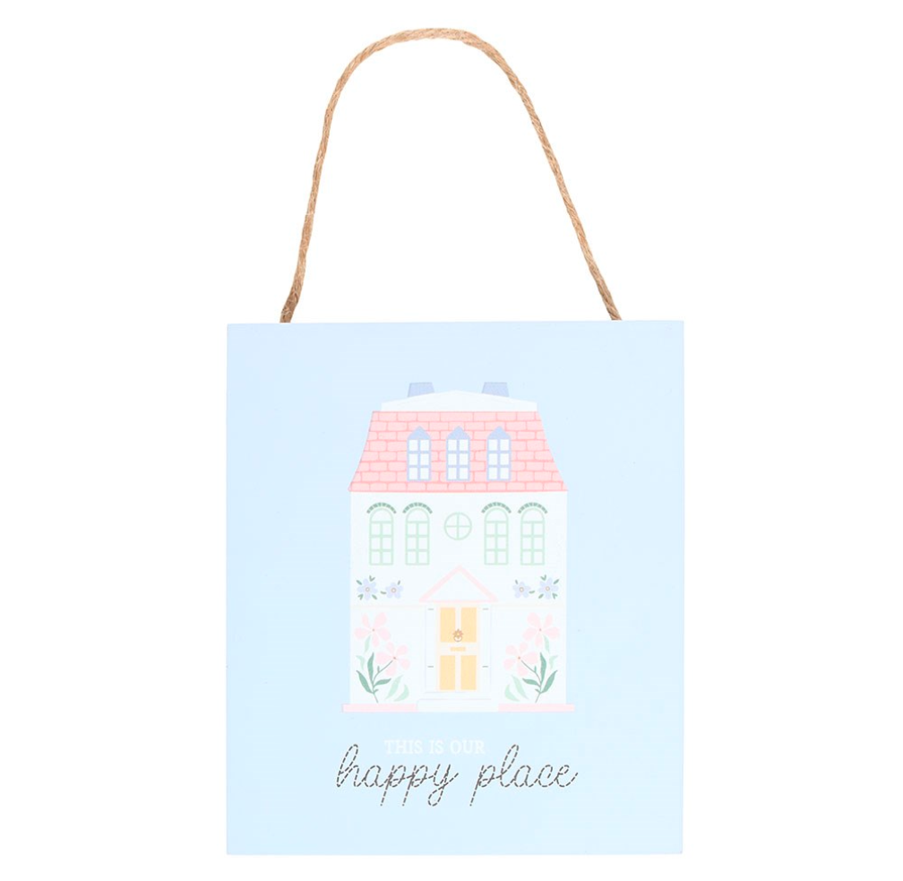A square light blue gift bag with a natural jute rope handle, featuring an illustration of a pastel house and the words 'happy place' in cursive at the bottom.