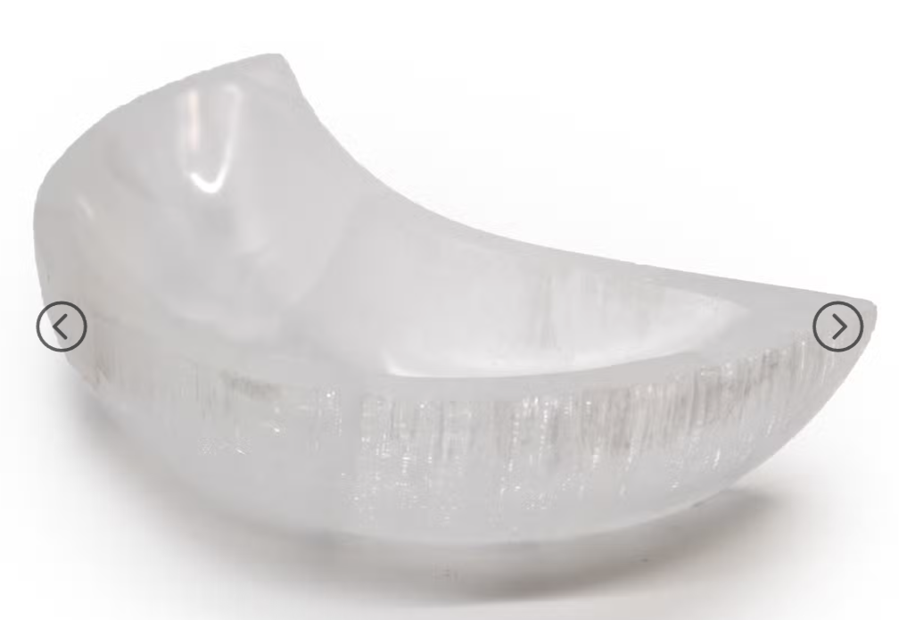 A translucent frosted glass bowl with a curved crescent shape, shown on a plain white background with subtle shadowing. The image has small navigation arrows overlaid on the left and right sides.