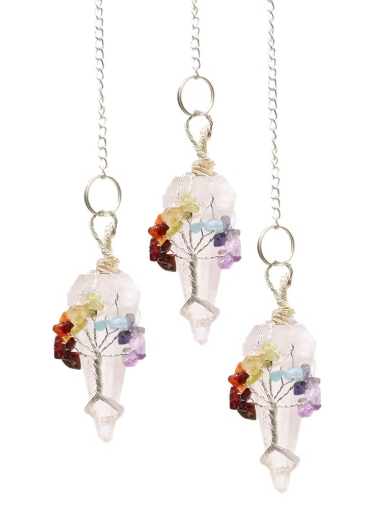 Three crystal pendants on silver chains, featuring pale pink quartz points wrapped with multicolored gemstone clusters and delicate wire tree details, set against a plain white background.