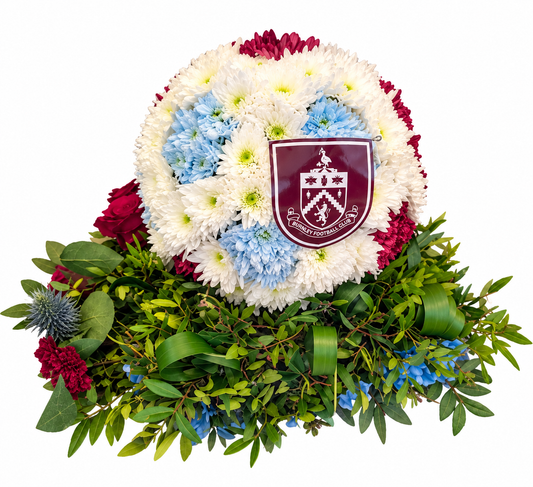 Bespoke football-shaped funeral floral tribute in personalised team colours